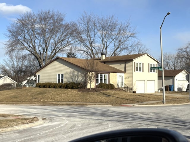 view of front of property featuring a garage