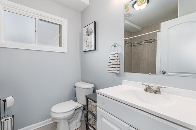 bathroom with vanity, toilet, and a shower with shower curtain