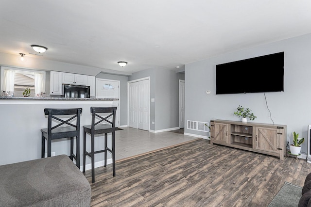 living room featuring dark hardwood / wood-style floors