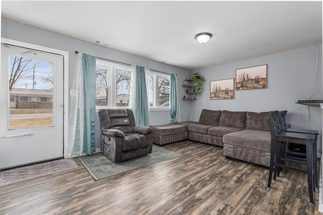 living room with dark hardwood / wood-style flooring