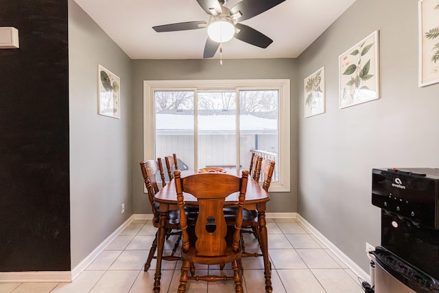 tiled dining room with ceiling fan