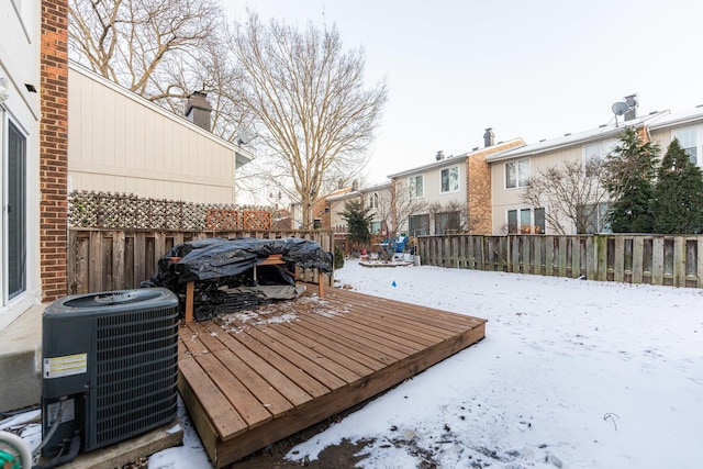 snow covered deck featuring central AC