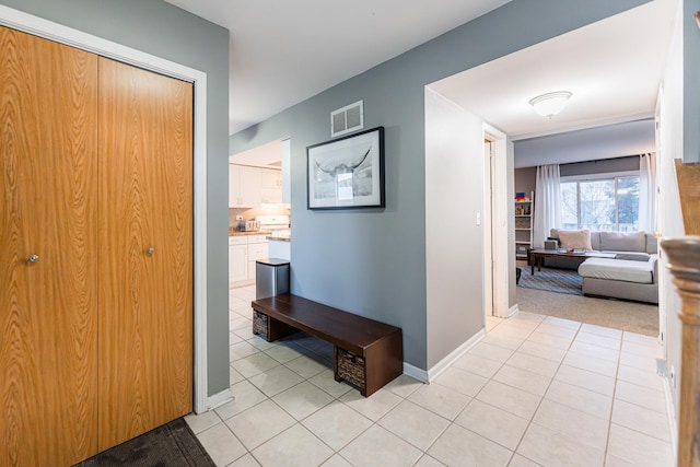 hall with light tile patterned flooring