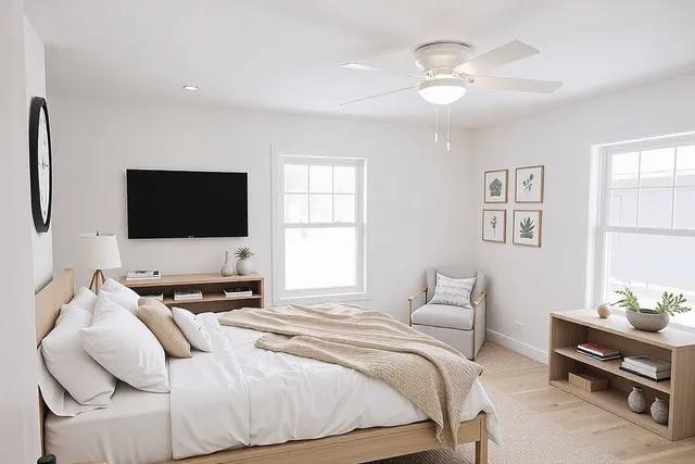 bedroom featuring ceiling fan and light hardwood / wood-style flooring