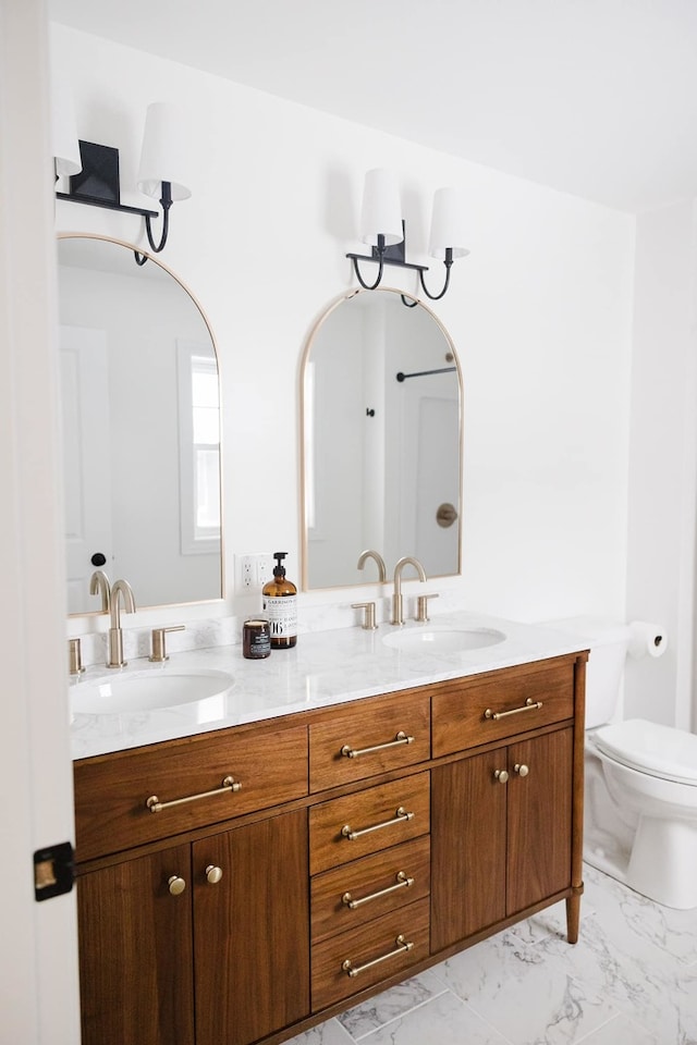 bathroom with vanity and toilet