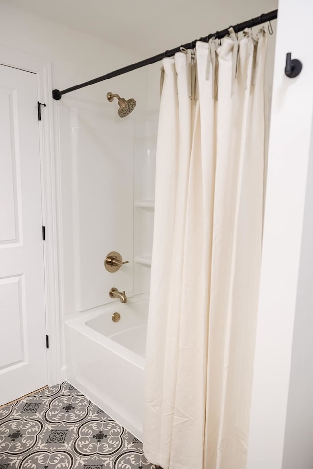 bathroom with shower / bath combo and tile patterned floors