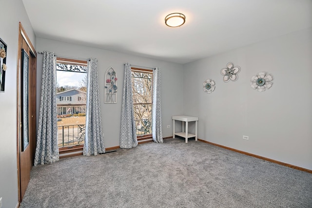 unfurnished room with carpet floors and a wealth of natural light