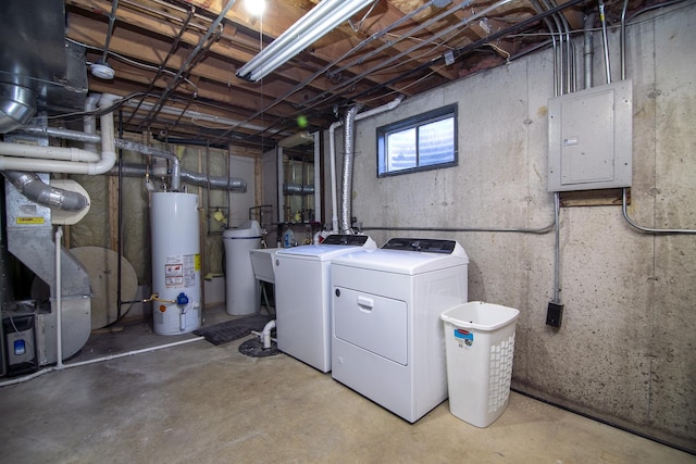 basement with gas water heater, electric panel, and independent washer and dryer