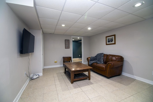 living room with a drop ceiling