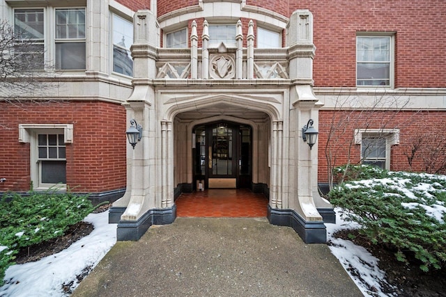 view of snow covered property entrance