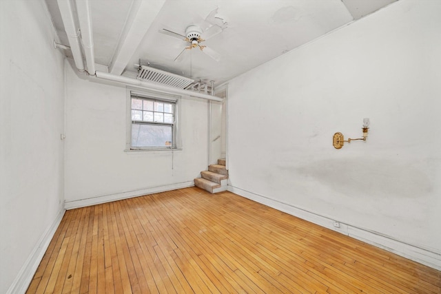 unfurnished room featuring ceiling fan and wood-type flooring