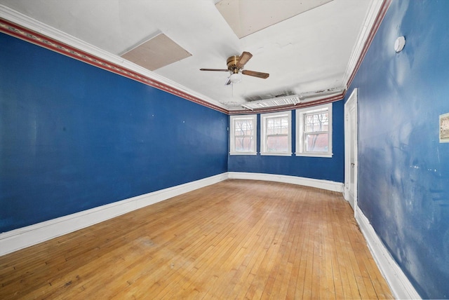 empty room with ornamental molding, ceiling fan, and light wood-type flooring