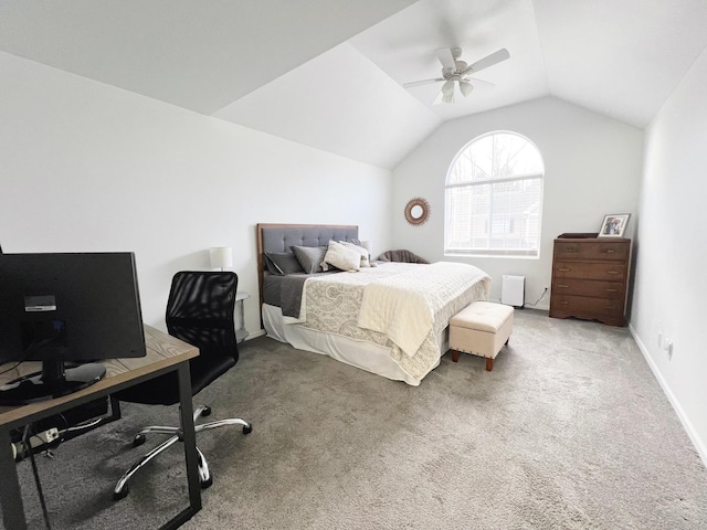 carpeted bedroom with vaulted ceiling and ceiling fan