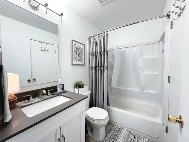 full bathroom featuring vanity, shower / bath combination with curtain, and toilet