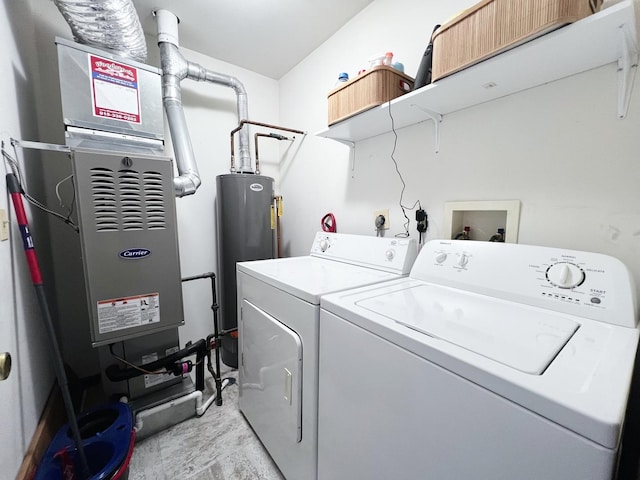 washroom featuring water heater and washing machine and clothes dryer