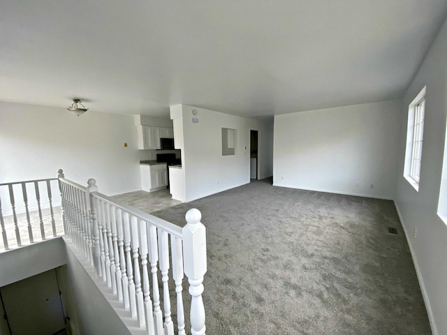 spare room featuring carpet flooring