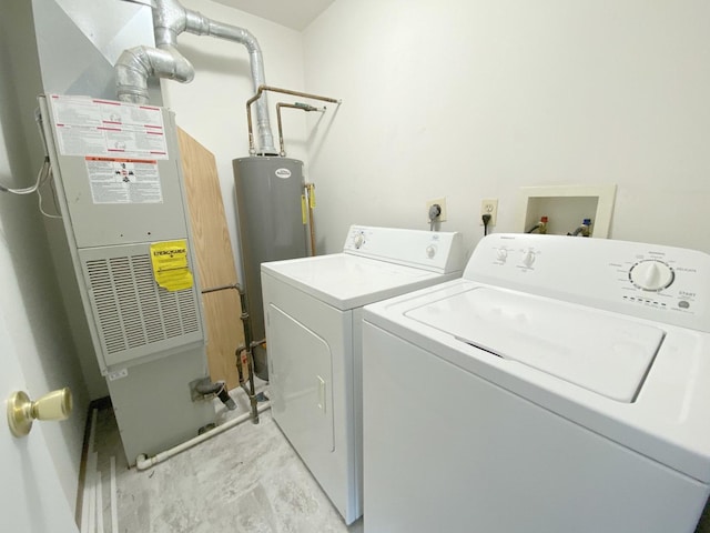 laundry area featuring heating unit, washer and clothes dryer, and water heater