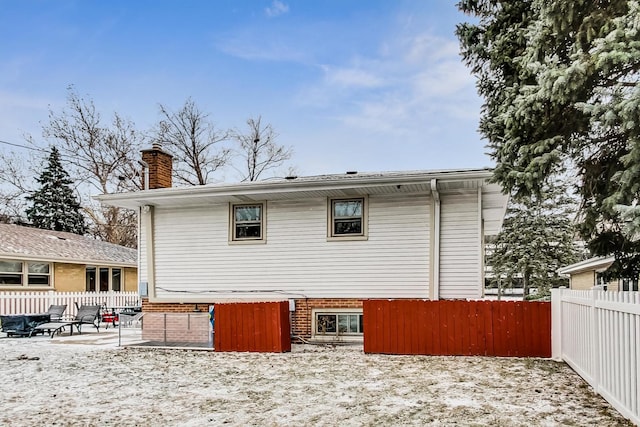 view of snow covered house