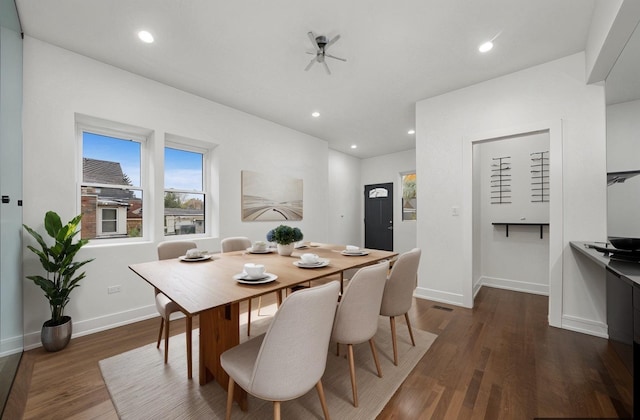 dining room featuring dark hardwood / wood-style flooring