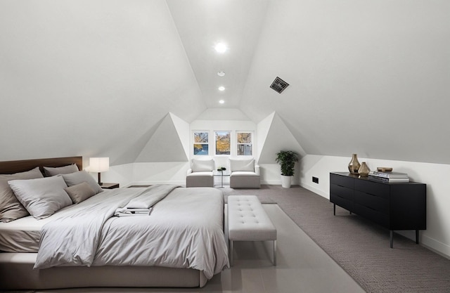 carpeted bedroom with vaulted ceiling