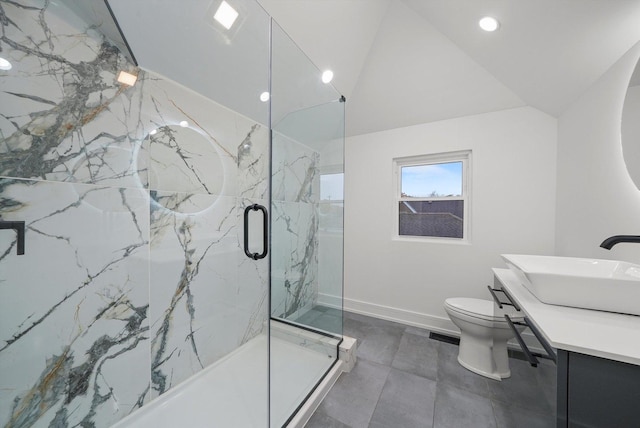 bathroom with vanity, lofted ceiling, an enclosed shower, and toilet