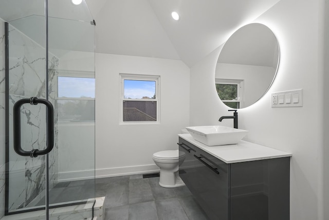 bathroom featuring lofted ceiling, vanity, toilet, and a shower with door