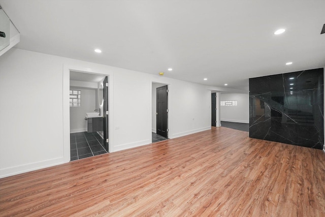 unfurnished living room with dark wood-type flooring