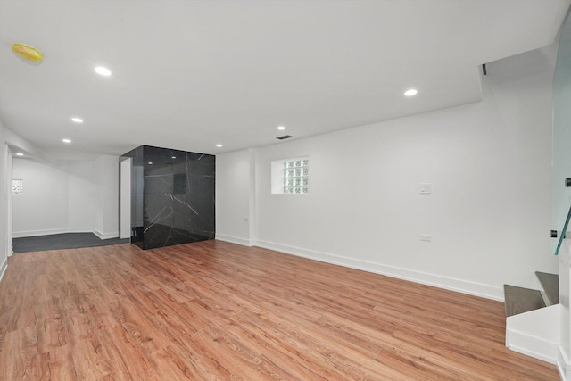 unfurnished living room featuring light wood-type flooring