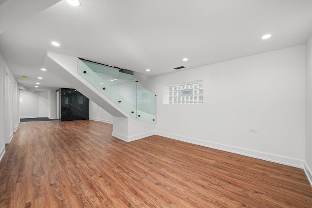 unfurnished living room with hardwood / wood-style floors