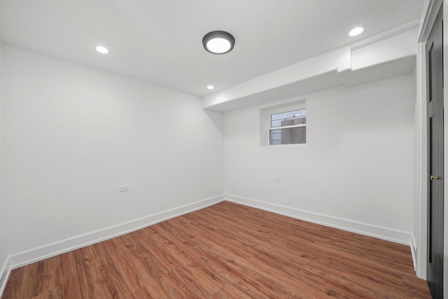 basement featuring wood-type flooring