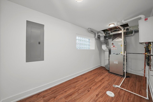 utility room with electric panel and heating unit