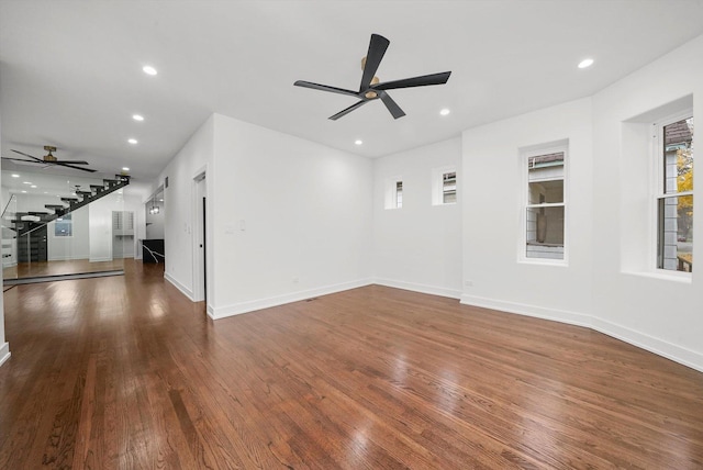 unfurnished living room with dark hardwood / wood-style floors