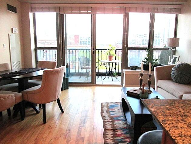 living room featuring plenty of natural light and light hardwood / wood-style floors