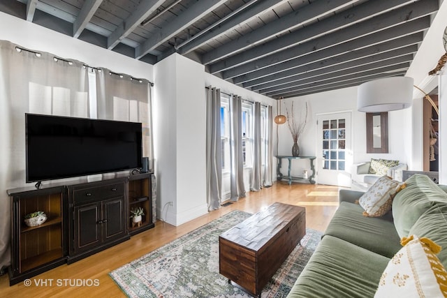 living room featuring light wood-type flooring, wood ceiling, and beam ceiling