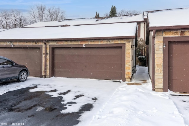 view of snow covered garage