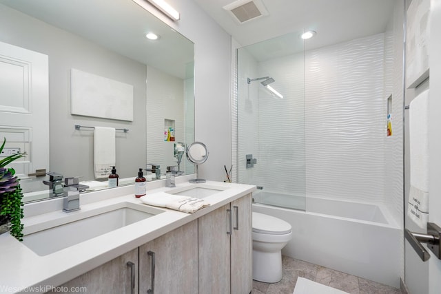 full bathroom with vanity, toilet, and tiled shower / bath