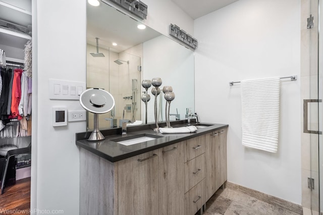 bathroom featuring vanity and walk in shower