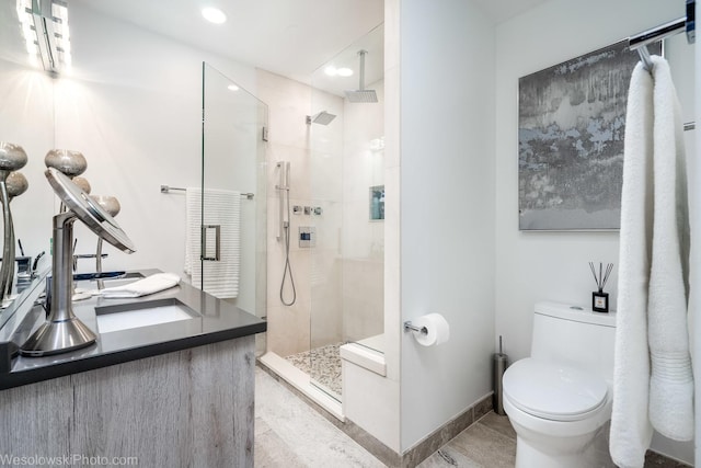 bathroom featuring walk in shower and toilet