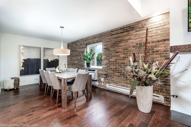 dining area with dark hardwood / wood-style flooring and brick wall