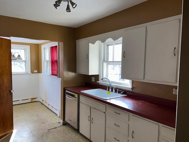 kitchen with sink, a wealth of natural light, stainless steel dishwasher, and white cabinets