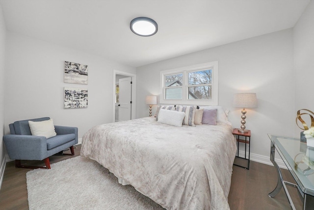 bedroom featuring dark hardwood / wood-style flooring