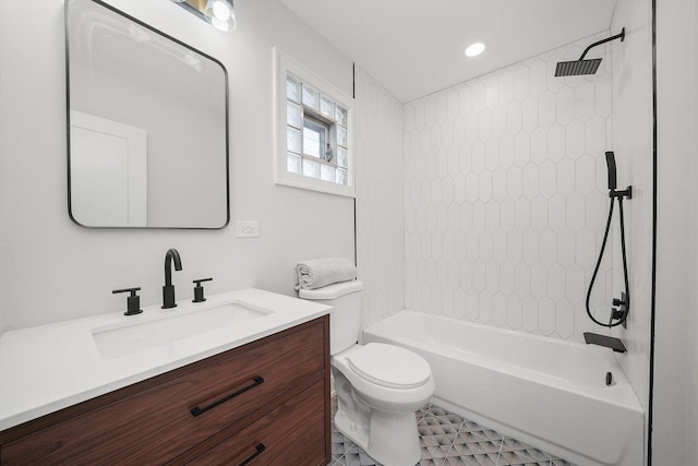 full bathroom featuring vanity, toilet, and tiled shower / bath