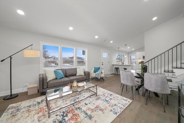 living room with dark hardwood / wood-style flooring and vaulted ceiling