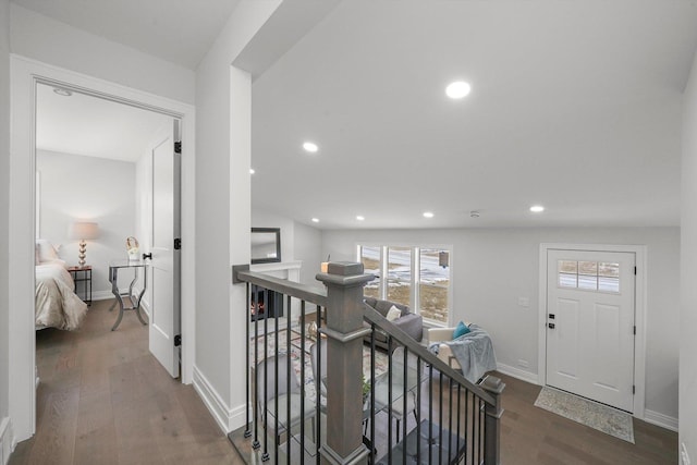 corridor with dark wood-type flooring and plenty of natural light