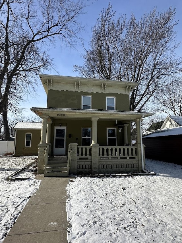 italianate-style house with covered porch