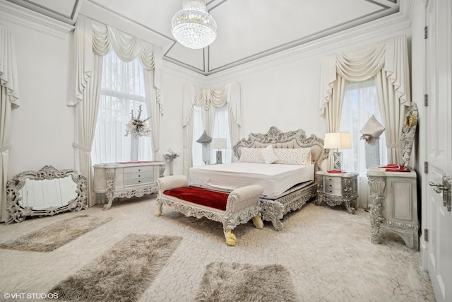 bedroom featuring ornamental molding, a chandelier, and multiple windows