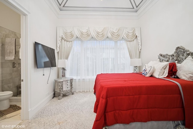 carpeted bedroom with ornamental molding and connected bathroom