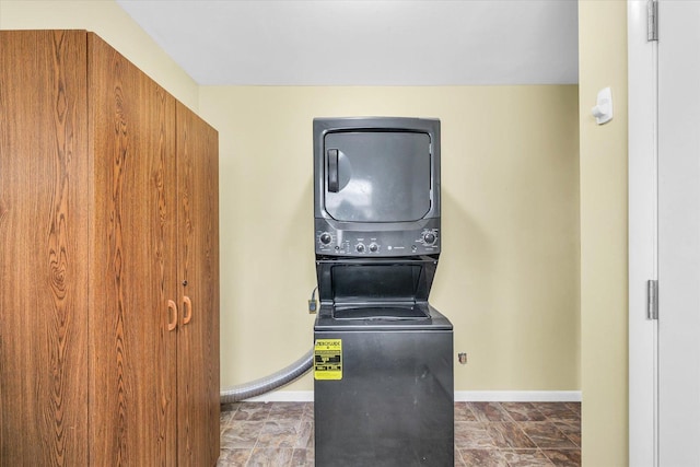 washroom with stacked washer / dryer