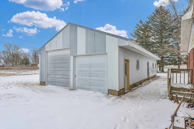 view of snow covered garage