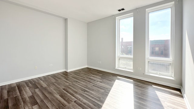 spare room with hardwood / wood-style floors